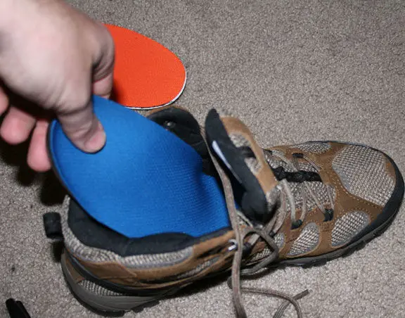 put insoles into the shoes